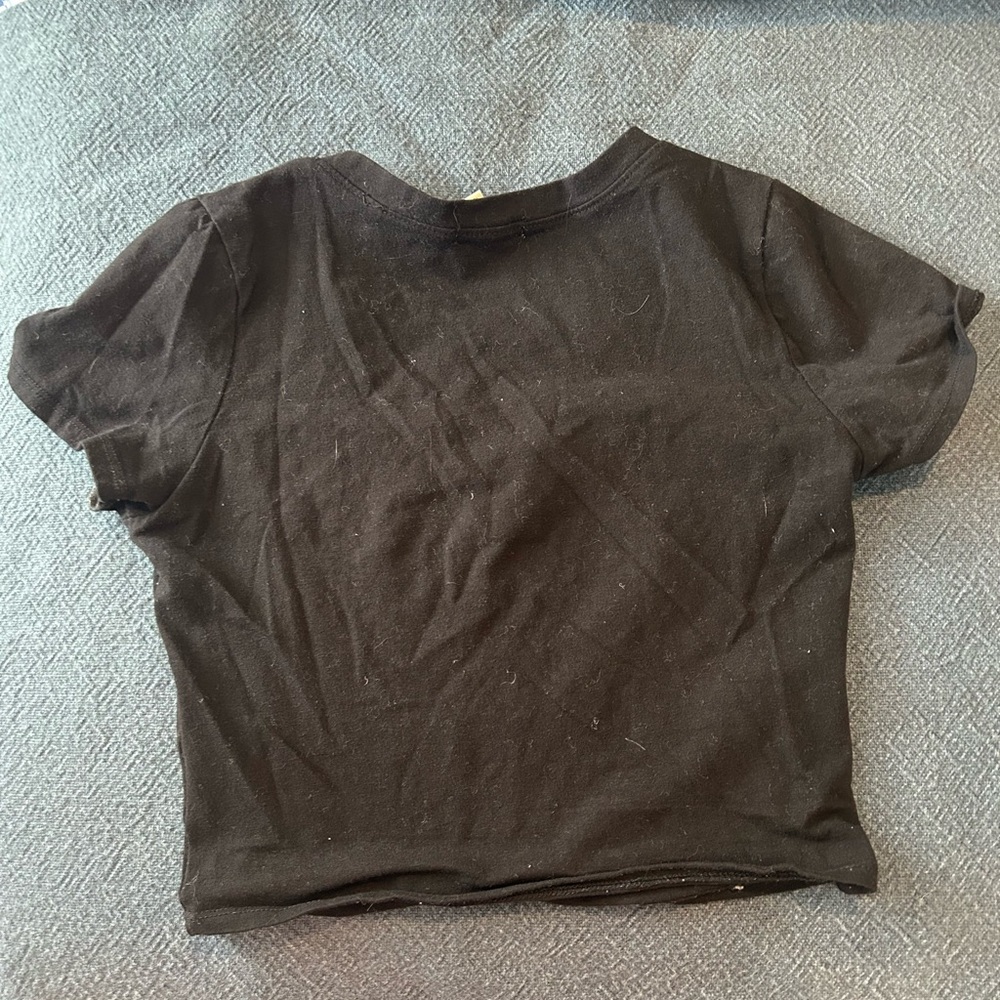 Black T-shirt. Cropped